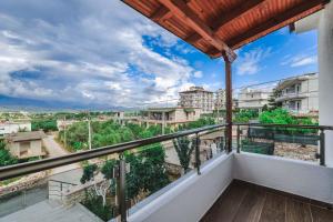 a balcony with a view of a city at Luka Apartments in Sarandë