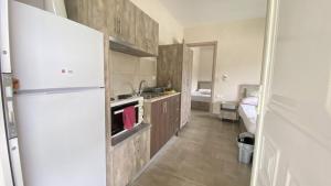 Kuchyň nebo kuchyňský kout v ubytování Kalouda Rooms