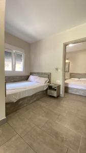Postel nebo postele na pokoji v ubytování Kalouda Rooms