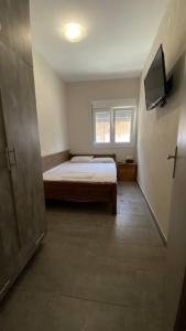 Postel nebo postele na pokoji v ubytování Kalouda Rooms