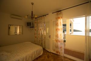 Postel nebo postele na pokoji v ubytování "Azzurra Apartments