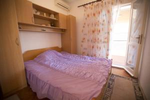 Postel nebo postele na pokoji v ubytování "Azzurra Apartments