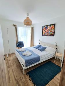 Postel nebo postele na pokoji v ubytování Szondi Corner Apartman