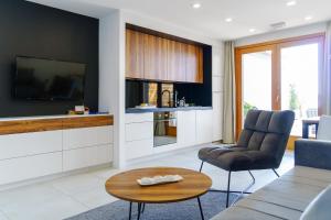 a living room with a couch and a table at Apartments Bikin in Brela