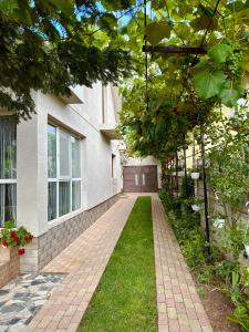 a brick walkway in front of a house at Casa Cristina in Tuzla