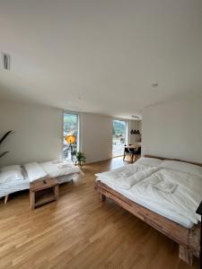 Кровать или кровати в номере The R Apartment Engelberg, KLIMA, NEU, Balkon, Parking