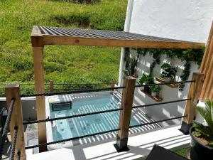 an overhead view of a deck with a plunge pool at B&C Furnas House in Furnas