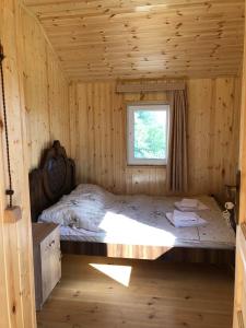 Postel nebo postele na pokoji v ubytování Hotel Okatsia სასტუმრო ოკაცია