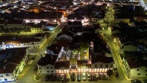 una vista aerea di una città di notte di Mar- Milfontes Rentals a Vila Nova de Milfontes