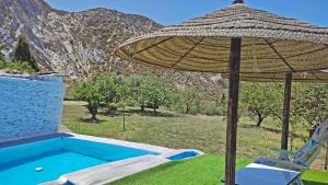 The swimming pool at or close to Cortijo AguaChá
