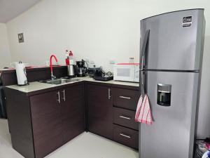 Kuchyň nebo kuchyňský kout v ubytování EcoStudio
