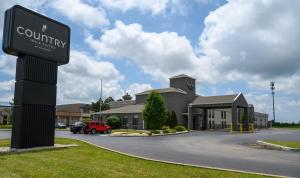 a street sign in front of a building at Country Inn & Suites by Radisson, Greenfield, IN in Greenfield