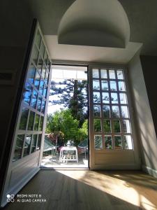an open door to a patio with a table at Pergolato suite in Sanremo +53 photos