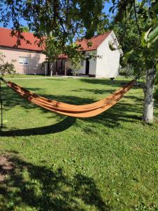 a hammock hanging from a tree in a yard at Matanovi dvori in Livno