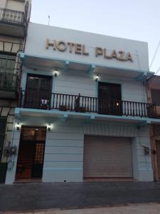 a hotel playa building with a dog sitting on a balcony at Hotel Plaza Centro Historico in Veracruz