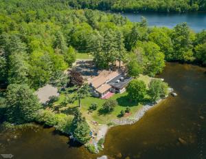 an aerial view of a house on a island in the water at Alamoosook Lakeside Inn Orland in Orland