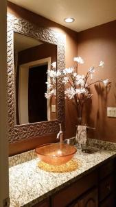 a bathroom with a bowl sink and a mirror at Private Luxury Estate on 5 acres in Scottsdale