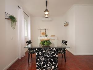 a dining room with a table with a cake on it at Forte do Ilhéu de Vila Franca in Vila Franca do Campo