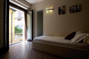 Postel nebo postele na pokoji v ubytování Hotel Leon D'Oro