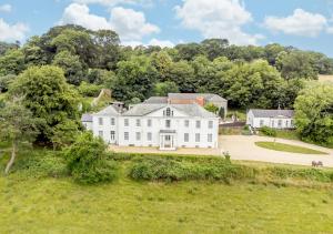 an aerial view of a large white house at Tracy - Upcott House in Barnstaple