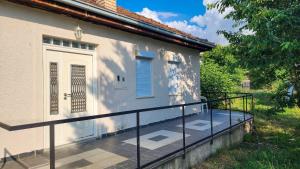 a balcony of a house with a white door at Crystal in Ohrid