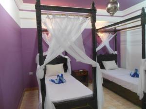 Postel nebo postele na pokoji v ubytování Cleopatra Hotel Luxor + 37 fotografií
