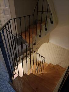 an overhead view of a spiral staircase with wooden floors at Piso NUEVO en centro de Madrid in Madrid
