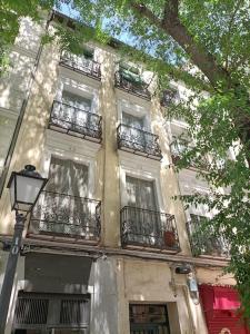 a building with balconies on the side of it at Piso NUEVO en centro de Madrid in Madrid