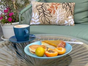 a table with a plate of food and a cup of coffee at B&B La mia Isola in Castelluzzo +79 photos