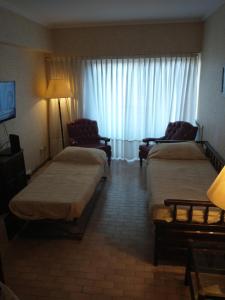 Una cama o camas en una habitación de Departamento Alvear zonas Güemes Torreón