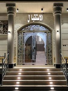 an entrance to a building with stairs and a door at فندق pulse للأجنحة الفندقية in Khamis Mushayt