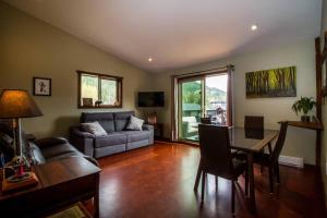 a living room with a couch and a table at The best 2 bedrooms suite in Revelstoke! in Revelstoke