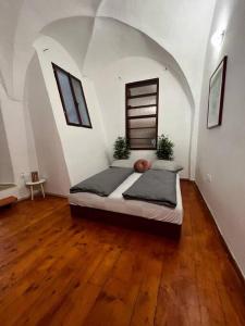 a bedroom with a large bed in an attic at City Center Apartment in Banská Bystrica