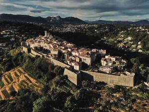an aerial view of a city with a castle at Triplex de Saint-Paul Free public parking in Saint Paul de Vence