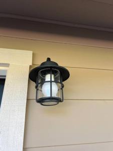 a light hanging on the side of a building at Wine Country - Country home 
