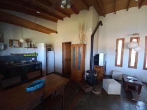 a living room with a refrigerator and a table at Casas Piedra del Sol 2 in Costa del Este