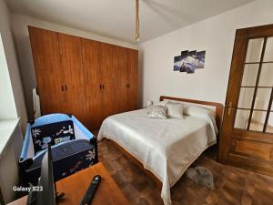 Postel nebo postele na pokoji v ubytování Locazione Turistica Varaita-Brossasco