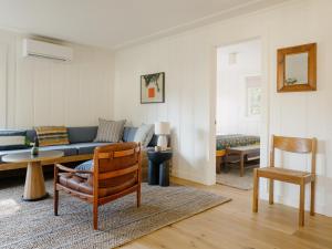 a living room with a couch and a chair at Dawn Ranch in Guerneville