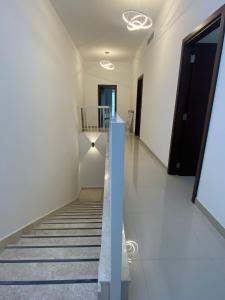 a staircase in a building with a hallway at The Pearl Villa 5 bedrooms with pool Sea and Mountain View in Fujairah
