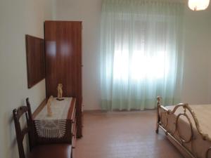 Postel nebo postele na pokoji v ubytování Terrazza sul Mare
