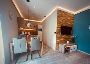 TV a/nebo společenská místnost v ubytování Apartmány Petr Vok
