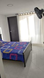 Katil atau katil-katil dalam bilik di Hermoso Apartamento en Santa Marta