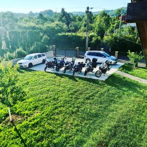 a group of motorcycles parked in a parking lot at Vila San Nicoara in Curtea de Argeş
