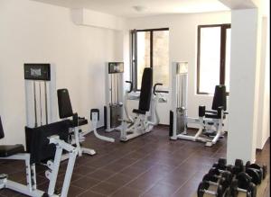 a gym with a bunch of tread machines in a room at Dream Villa in Imperial Heights Villas in Sunny Beach