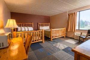 Postel nebo postele na pokoji v ubytování Candlestone Golf and Resort