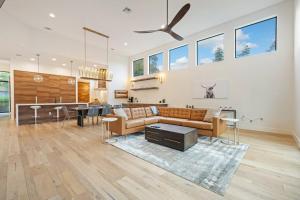 a living room with a couch and a table at central contemporary w/ POOL and SPA in Austin