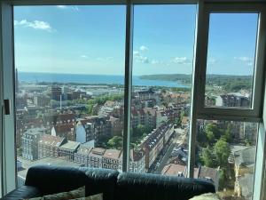 a view of a city from a large window at Unik udsigt og beliggenhed in Aarhus