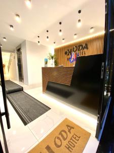 a restaurant lobby with a job return sign on the door at Apartments Oda Hotel in Velipojë