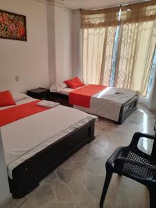 Postel nebo postele na pokoji v ubytování HOTEL NUEVO SOL