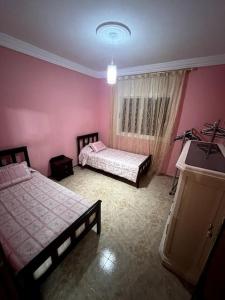 Una cama o camas en una habitación de Appartement familiale méditerranéen